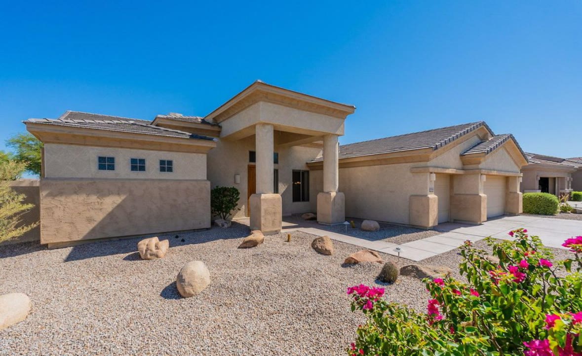 Single-story Arizona home with desert landscaping, representing off-market real estate opportunities
